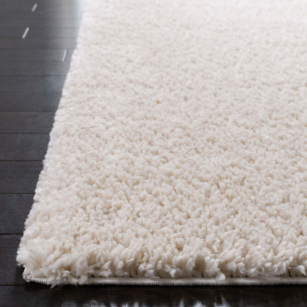 Tapis SAFAVIEH August Wilhelma Shag uni de 3 cm d'épaisseur
