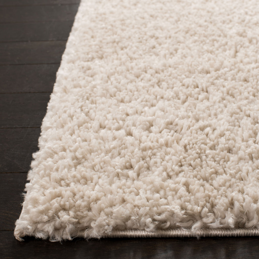 Tapis SAFAVIEH August Wilhelma Shag uni de 3 cm d'épaisseur