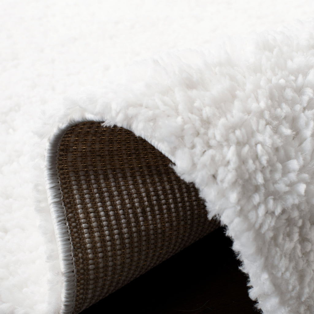 Tapis SAFAVIEH August Wilhelma Shag uni de 3 cm d'épaisseur