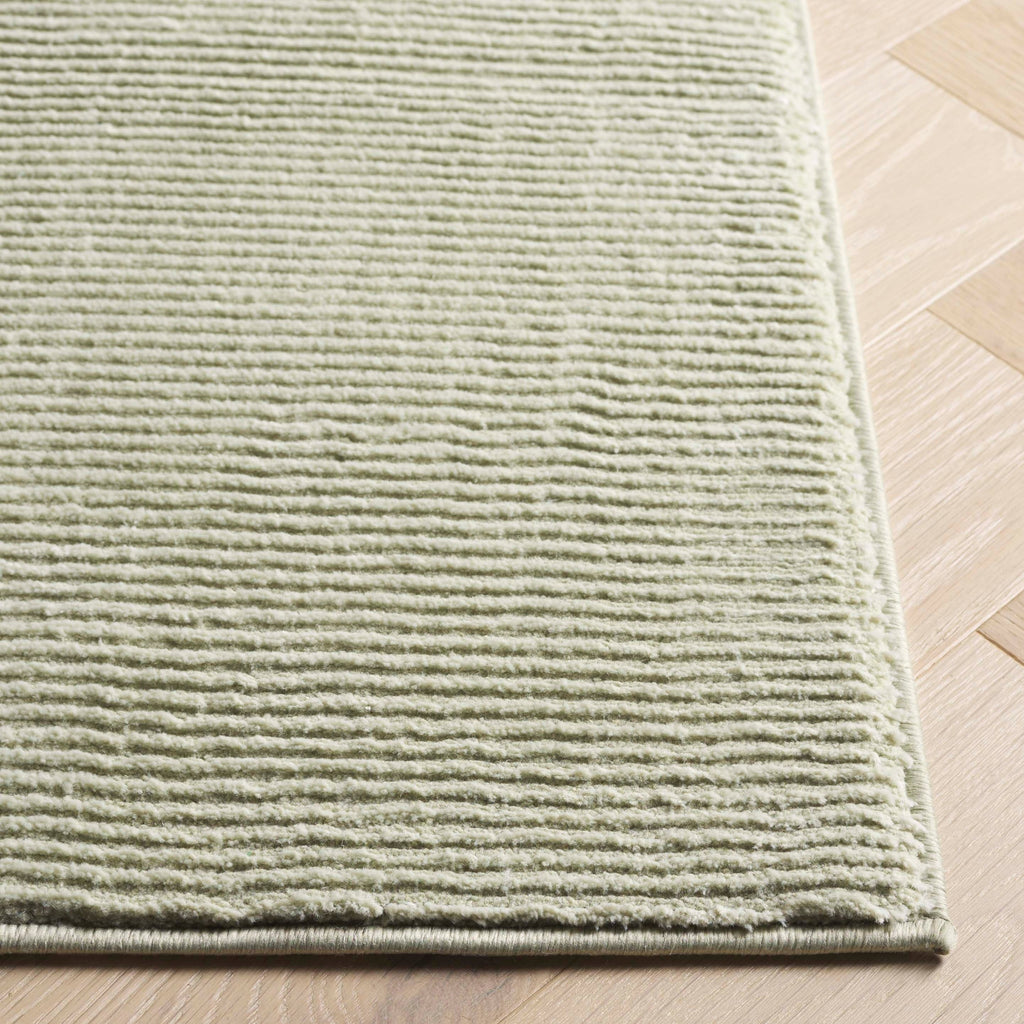 SAFAVIEH Revive Avie Solid Rug