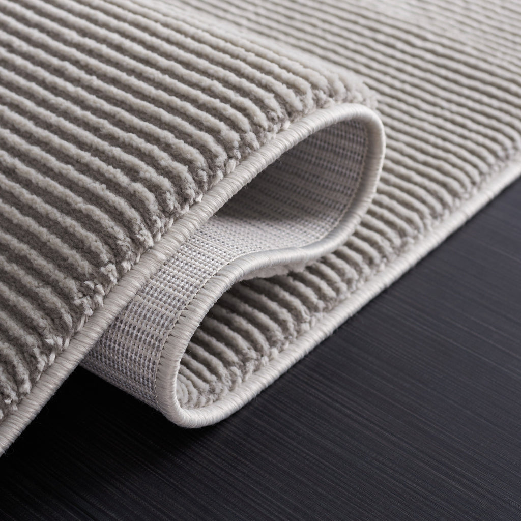 SAFAVIEH Revive Avie Solid Rug